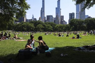 People sunbathe in Central Park in the Manhattan borough of New York city during Memorial Day weekend on May 26, 2024. (Photo by CHARLY TRIBALLEAU / AFP) (Photo by CHARLY TRIBALLEAU/AFP via Getty Images)