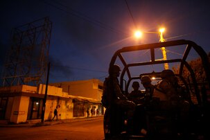 A National Guard patrol car full of soldiers stands guard outside the local headquarters of the federal attorney general's office, in Coatzacoalcos, Veracruz state, Mexico, Friday, Aug. 30, 2019. Mexico's drug war appears to be back, and it may be worse this time around than in the bloody years of the government's 2006-2012 offensive against drug cartels. That was evident this week in Coatzacoalcos, an oil industry city in the Gulf coast state of Veracruz where residents say gangs have been fighting over turf and extorting business owners with threats of violence. (AP Photo/Rebecca Blackwell)